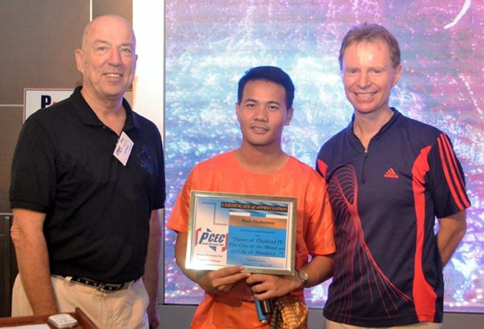 MC Roy Albiston presents the PCEC’s Certificate of Appreciation to Pasit Foobunma and Ren Lexander for their presentation on Pasit’s Tastes of Thailand tours to Chanthaburi and Lopburi.