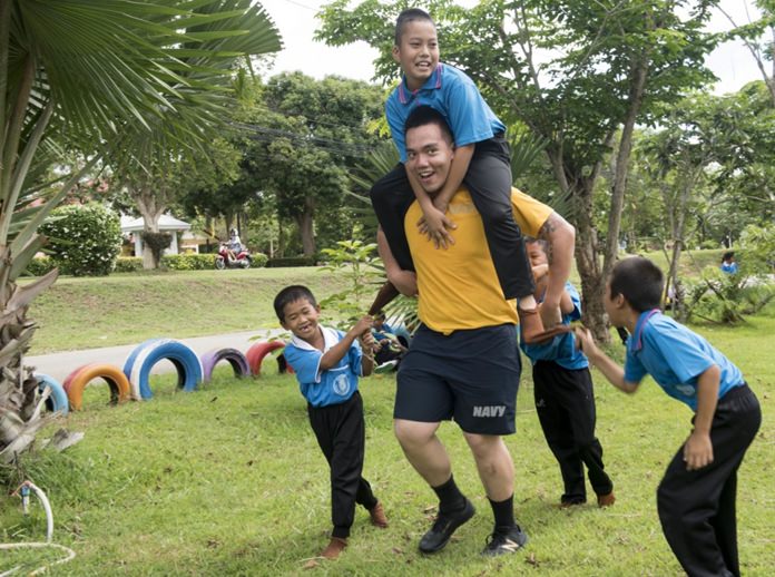 Sattahip (June 22, 2016) Culinary Specialist Seaman Andre Galit plays with children from Chuksamet School during a community service event. (U.S. Navy photo by Mass Communication Specialist 2nd Class Joshua Fulton/Released)
