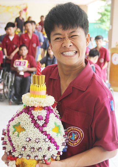 On Wai Khru Day, students present floral decorations to their teachers.
