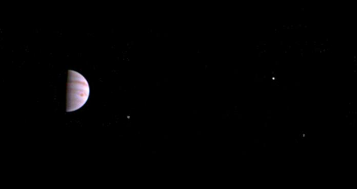 This July 10, 2016, image released by NASA was taken by the Juno spacecraft, five days after it arrived at Jupiter. The image shows Jupiter’s Great Red Spot and three of its four largest moons. (Juno/NASA/JPL-Caltech/SwRI/MSSS via AP)