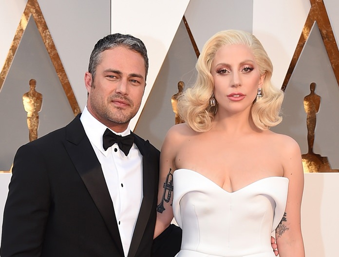Taylor Kinney (left) and Lady Gaga are shown together in this Feb. 28, 2016, file photo. (Photo by Jordan Strauss/Invision/AP)
