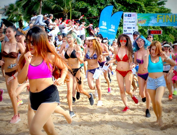 Scantily clad competitors race from the start line on Pattaya Beach during the inaugural Bikini Run on August 6.