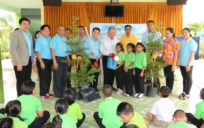 Mayor Mai Chaiyanit presides over an event where about 120 students, teachers and Nongprue officials planted trees at Tung Kom School.