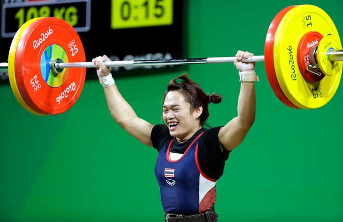 Sukanya Srisurat drops the barbell after a successful lift in the women’s 58kg weightlifting competition at the 2016 Summer Olympics in Rio de Janeiro, Brazil, Monday, Aug. 8. (AP Photo/Mike Groll)