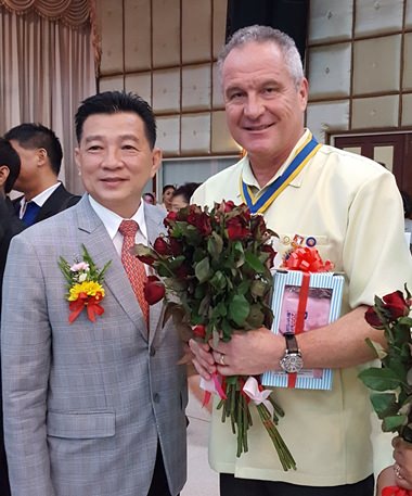 Dr. Olivier Meyer, President of Rotary Club of Pattaya with DG Eknarong.