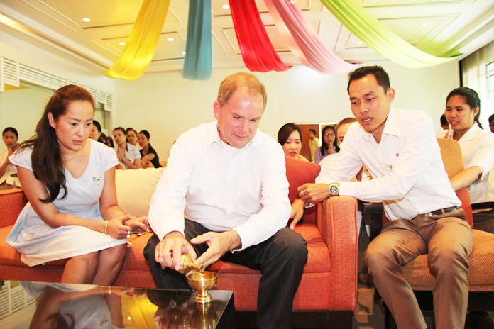 Robert Rijnders (center), senior vice president of operations and general manager for Onyx Hospitality Group’s eastern region, leads the Amari management and staff in religious ceremonies.