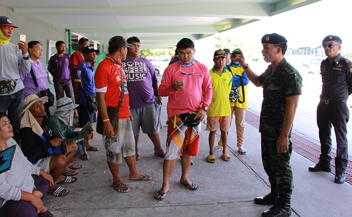 Local officials and soldiers confront Bali Hai Pier vendors after complaints about aggressive and possibly illegal sales tactics.