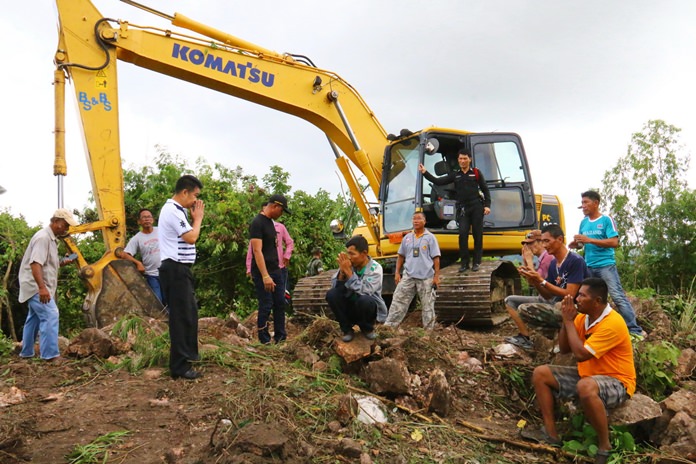 A former policeman and three contractors have been arrested for razing trees and digging up public land on Sattahip’s Khao Malakoh.