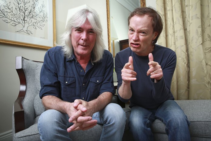 AC/DC bassist Cliff Williams (left) and guitarist Angus Young pose for a portrait in this Nov. 13, 2014 file photo. (Photo by Amy Sussman/Invision/AP)