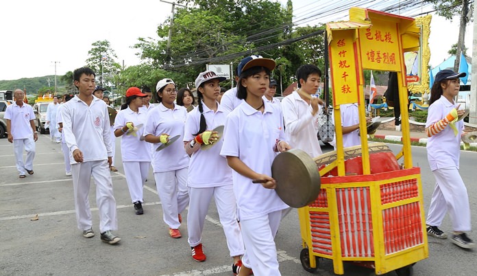Students wear white and keep tradition in the Sattahip parade.