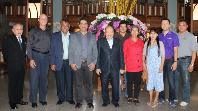 Friends including Philippe Delaloye (2nd left) gather for a group photo with Chatchawal in the spacious Cholchan Hotel lobby. They are flanked by Jakrapong Vitayasirikul (left) and Pin Krasang.