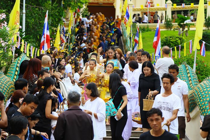 Monks and lay people alike take part in the Tak Bat Devo procession down the hill depicting the path Buddha took down a “celestial stairway” made of silver, gold and crystal.