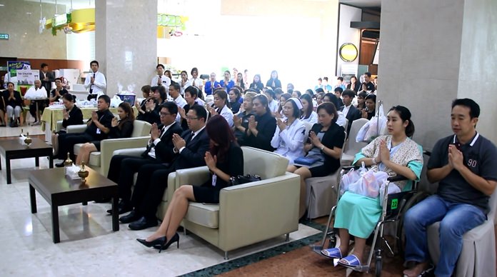 Many doctors, nurses, office staff, patients and friends solemnly take part in the ceremonies at Bangkok Hospital Pattaya.
