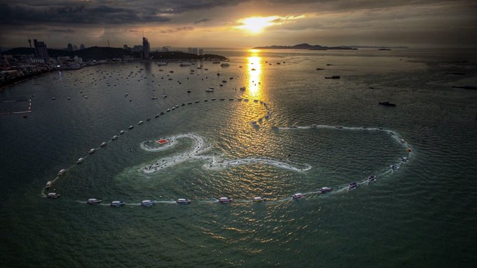Some of the 1,000 + boats and jet skis that took part in the event create a massive heart and Thai number 9 to honor King Rama IX.