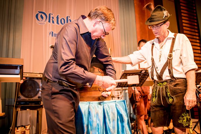 Richard Gamlin, resident manager of Amari Pattaya (left) ‘taps’ the beer barrel to officially get the Oktoberfest underway.