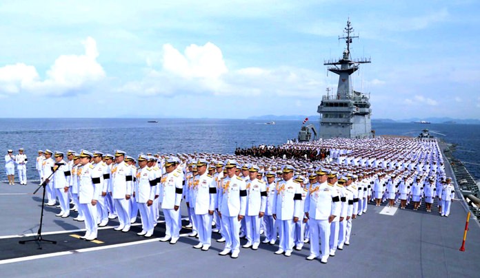 About 2,500 sailors sang the royal anthem in tribute to HM the late King aboard the HTMS Chakri Naruebet.
