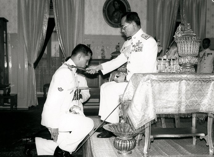 HM King Rama IX decorates HRH Crown Prince Maha Vajiralongkorn with badges of Rear Admiral and Air Vice Marshal in a ranking ceremony on September 10, 1987.