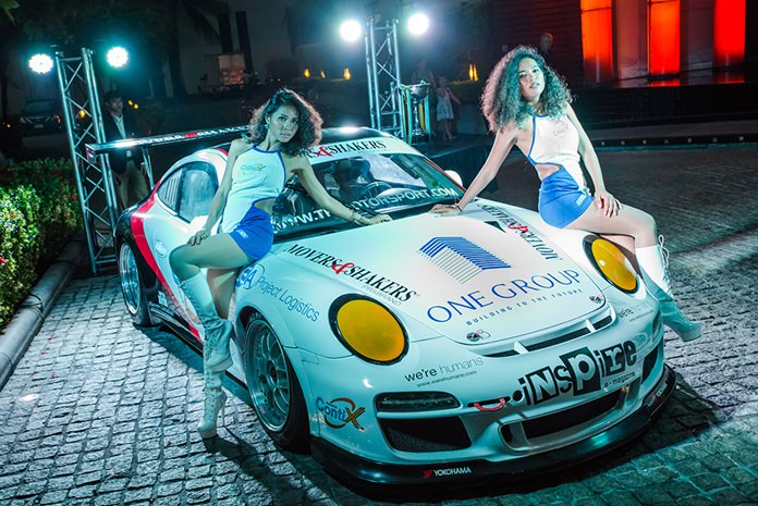 Two lovely grid girls pose with the Porsche 997 Generation One – GT3 from TR-Motorsport.