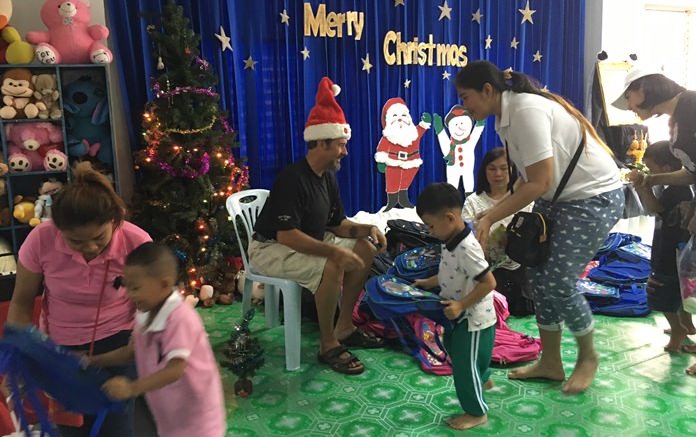 Santa Claus this year was portrayed by Jesters’ Joake, who handed school bags to the children courtesy of the Jesters Care for Kids.