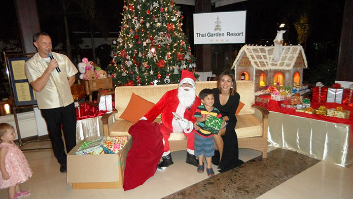 The pictures show some of the children receiving their presents from Santa.