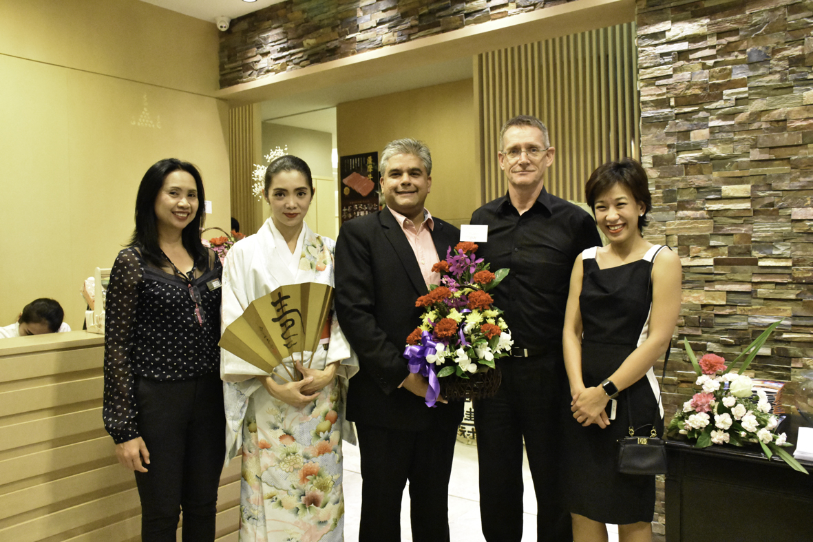 Tony Malhotra (centre) GM of the Scandinavian Village Bangsaen presents a congratulatory bouquet to Thomas Tapken (2nd right) MD of Pattaya Golf Club & Resort. At left is Nongnuch Promjan, PA to the MD and Phansiri Mongkolprasi (right) Director of PR & Marketing.