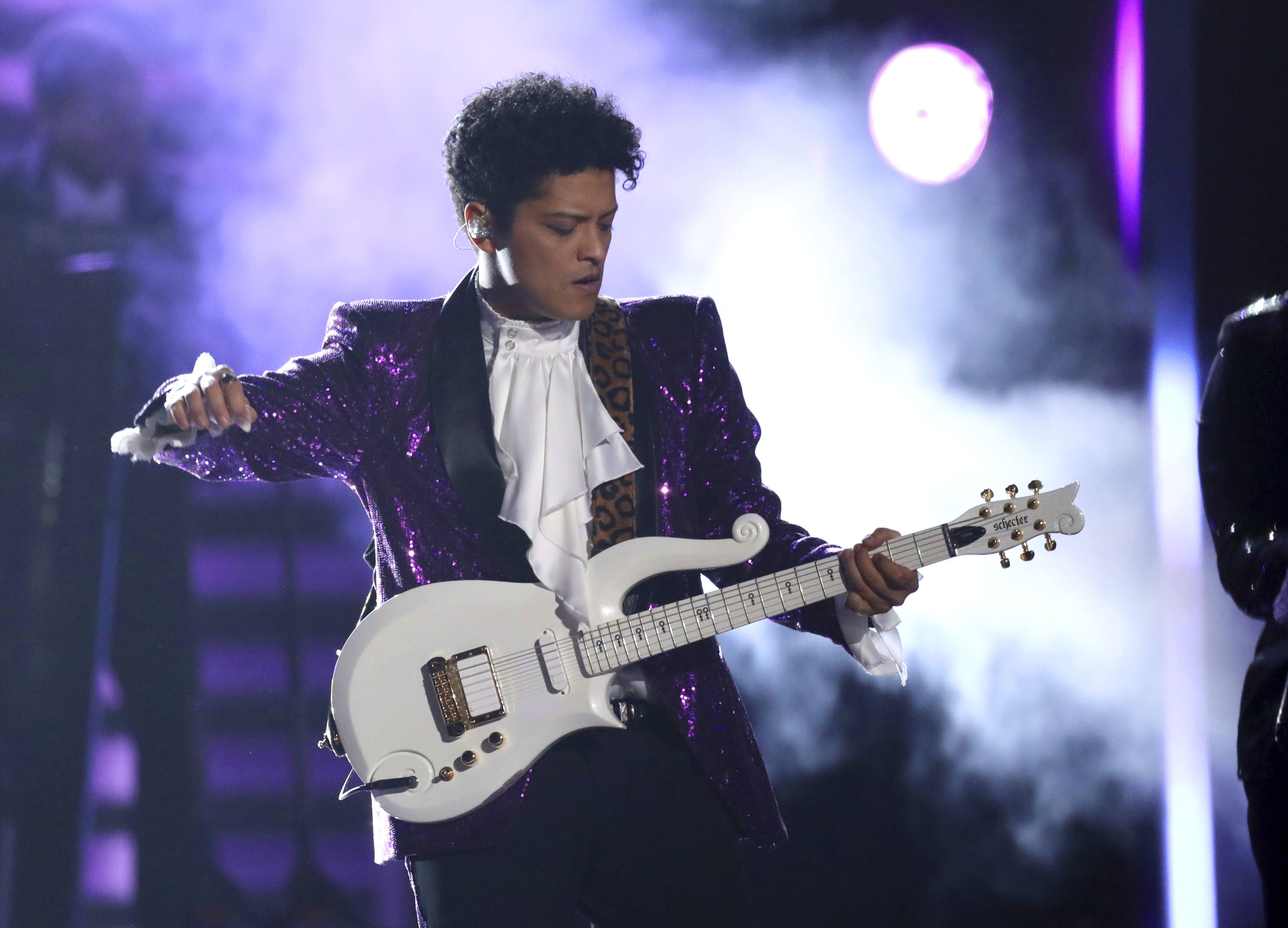 Bruno Mars performs "Let's Go Crazy" during a tribute to Prince at the 59th annual Grammy Awards in Los Angeles. (Photo by Matt Sayles/Invision/AP)