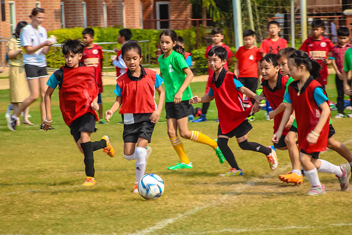 Children run off some of their energy in the mixed gender football match.