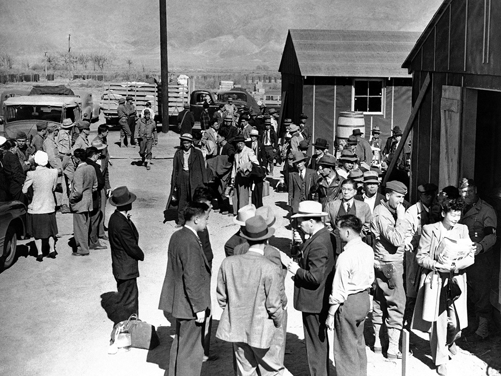 This March 23, 1942 file photo shows the first arrivals at the Japanese evacuee community established in Owens Valley in Manzanar, Calif., part of a vanguard of workers from Los Angeles. (AP Photo/File)