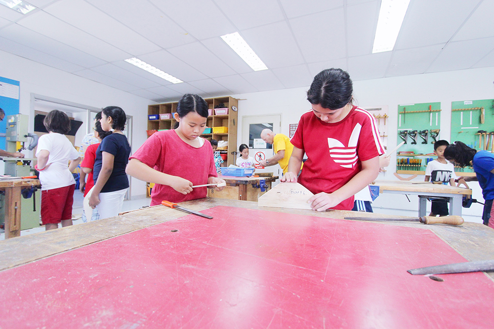 Concentrating hard, students made their own boomerangs.