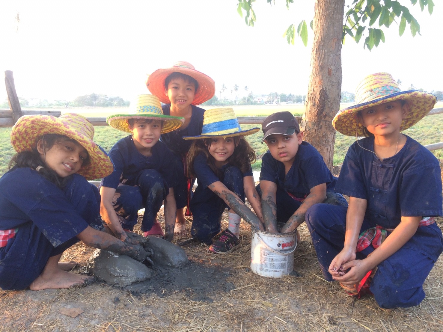 Building a clay oven can get a little messy.