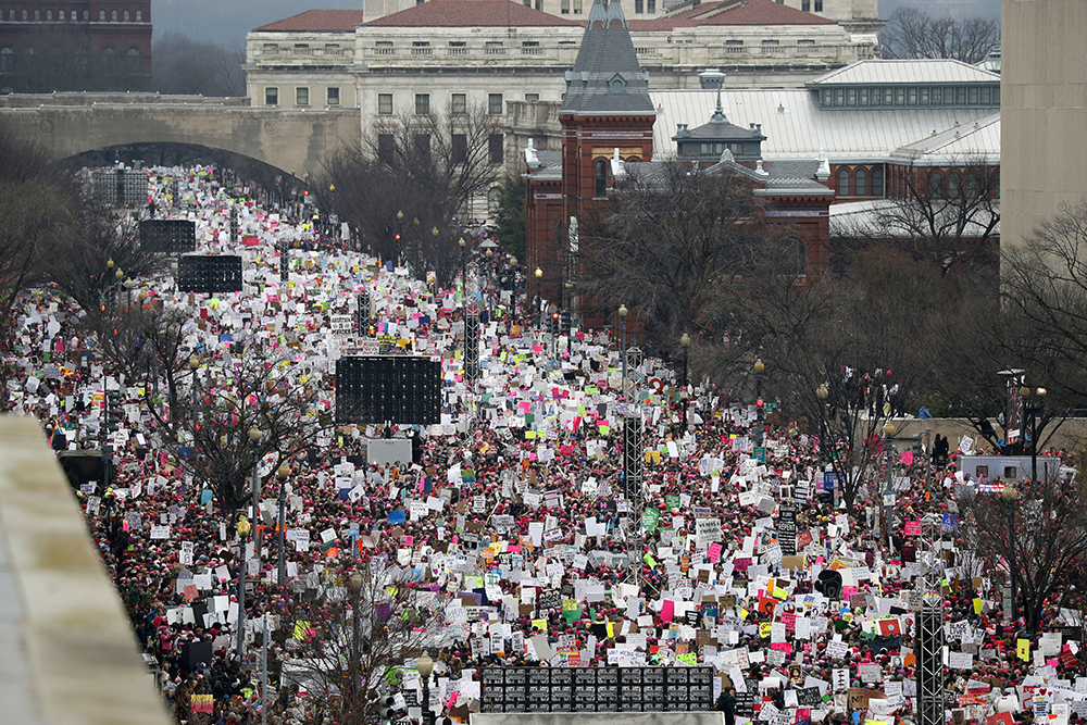 In this Jan. 21, 2017, file photo, a crowd fills Independence Avenue during the Women's March on Washington, in Washington. Social media is fueling resistance to President Donald Trump, helping people organize protests, raise money for refugee and immigrant rights groups and otherwise get the word out. It's making possible political action that organizers from the 1960s could have hardly imagined. (AP Photo/Alex Brandon, File)