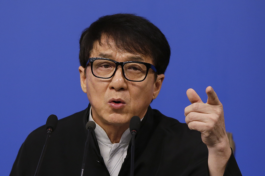 Hong Kong movie star Jackie Chan speaks to the media at a press conference in Beijing, Tuesday, March 7. (AP Photo/Andy Wong)