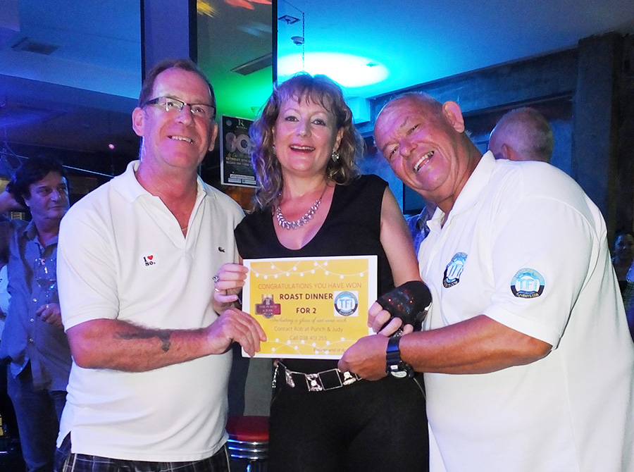 Richard and Rodney present Angie Turton with a gift voucher from Punch & Judy.