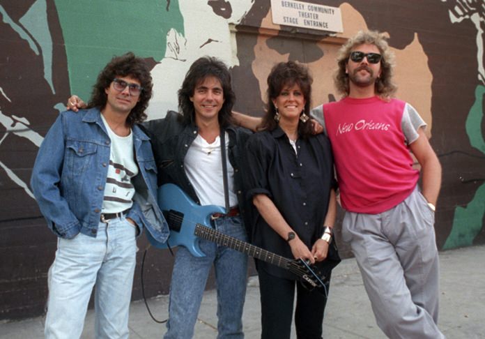 In this July 24, 1987 file photo, members of Starship, from left, Mickey Thomas, Craig Chaquico, Grace Slick and Donny Baldwin, pose outside the Berkeley Community Theater in Berkeley, Calif. (AP Photo/Doug Atkins)