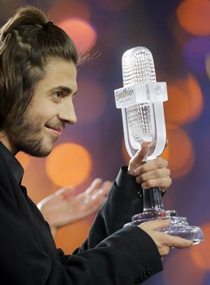 Salvador Sobral from Portugal celebrates as he holds the trophy after winning the Eurovision Song Contest in Kiev, Ukraine, Saturday, May 13. (AP Photo/Efrem Lukatsky)