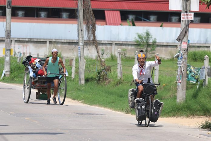 On May 22 they pulled their rickshaw into Pattaya on their way through Thailand.