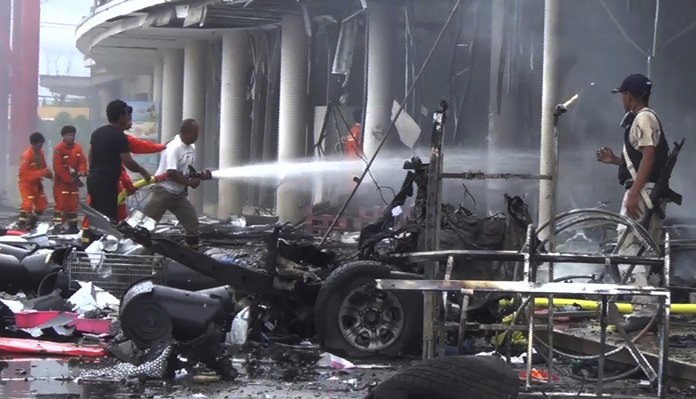 Suspected insurgents detonated a car bomb Tuesday outside the busy shopping center wounding more than 50 people in a huge blast that ripped the building apart and sent people running for their lives. (AP Photo)