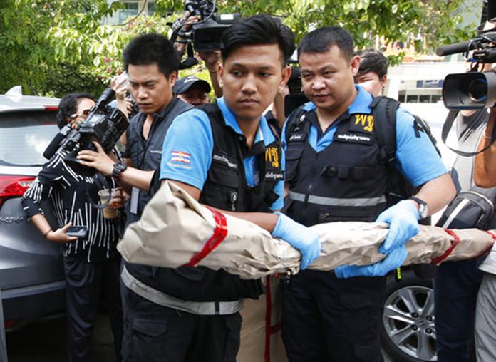 Thai forensic officers carry out collected evidence from Phramongkutklao Hospital. (AP Photo/Sakchai Lalit)