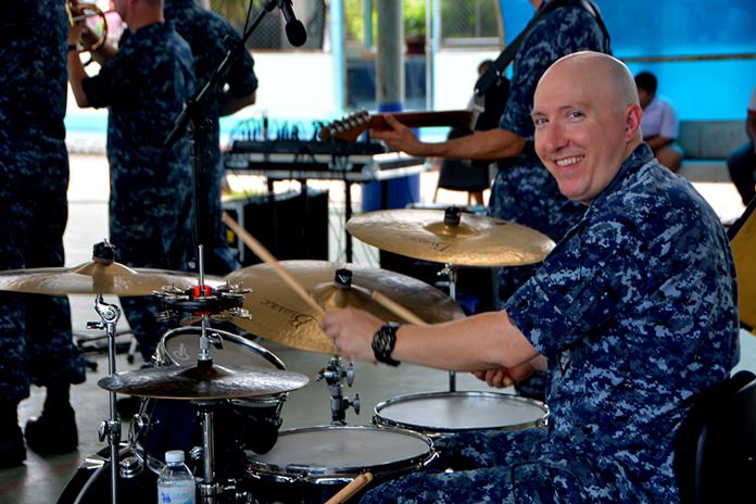 Navy Musician 1st Class Stephen Hux, of the U.S. 7th Fleet Band, Orient Express, jams out during a performance at Pattaya City School No. 8 l as part of Cooperation Afloat Readiness and Training Thailand 2017 in Pattaya, June 2. 