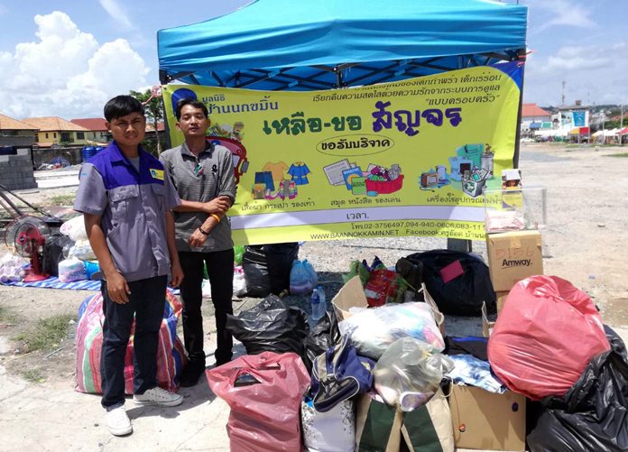 Members of the Baan Nokamin Foundation children’s shelter collect cash, clothes and other necessities at a donation event in Pattaya.