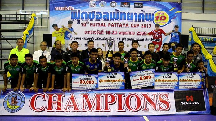 Players from Sukhumnawapan Uppatham School pose with the champions’ trophy after winning the under-18 title at the 10th annual Pattaya Futsal Cup.