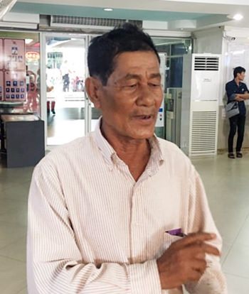 Thongin Panprasong, 71, after he was victimized by con men who prey on senior citizens.