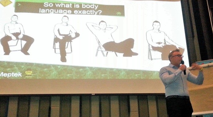 Jakob shows a slide of four body positions; he then described for his PCEC audience how to interpret each of the positions.