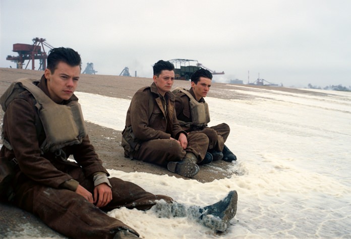 This image shows (from left) Harry Styles, Aneurin Barnard and Fionn Whitehead in a scene from “Dunkirk.” (Warner Bros Pictures via AP)