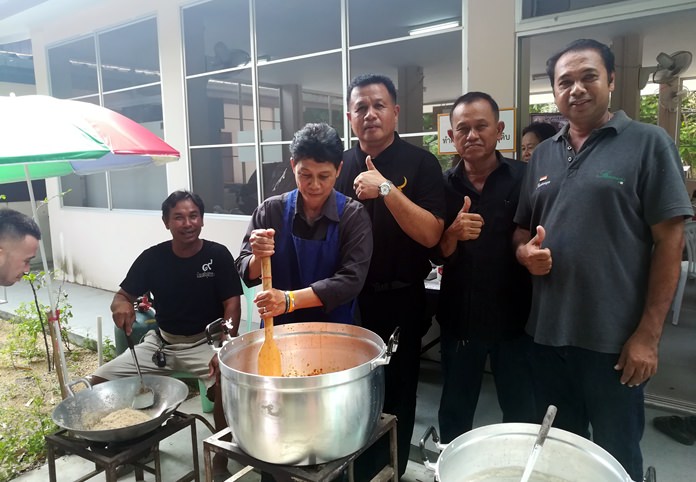 Mayor Pinyo Homkaln and sub-district officials open the Ban Nong Ket Yai Community Enterprise product workshop showing Nong Plalai residents how to make and package chili paste to earn extra income.
