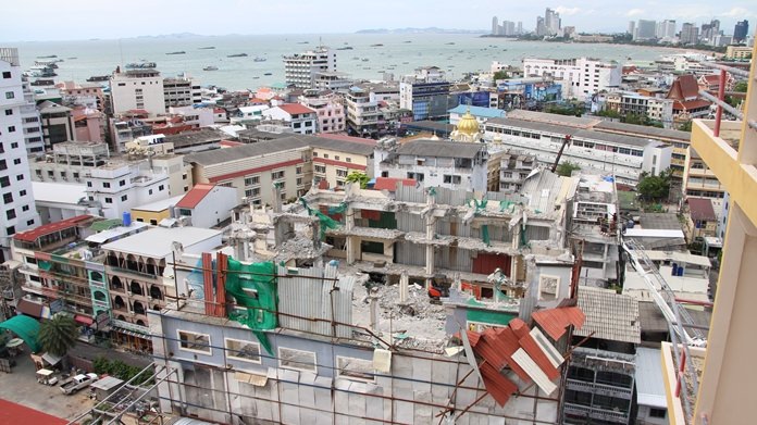 Pattaya workers have been removing metal sheets covering the demolished upper floors of a condemned South Pattaya hotel after fears they could fly off and kill a pedestrian.