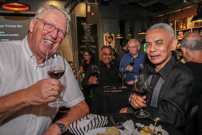 Helge Holst and Capt. Sitthichoke Adinan enjoying the excellent wines.