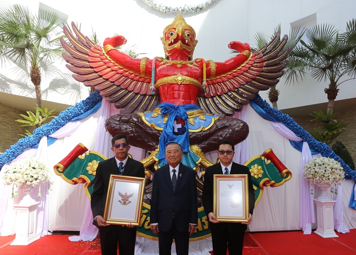 Dr. Prasert Prasarttong-Osoth, chairman of Bangkok Dusit Medical Services PLC, presides over the hoisting to a place of honor on the facility’s main building, the Royal Garuda emblem awarded by HM the late King to Bangkok Hospital Pattaya.
