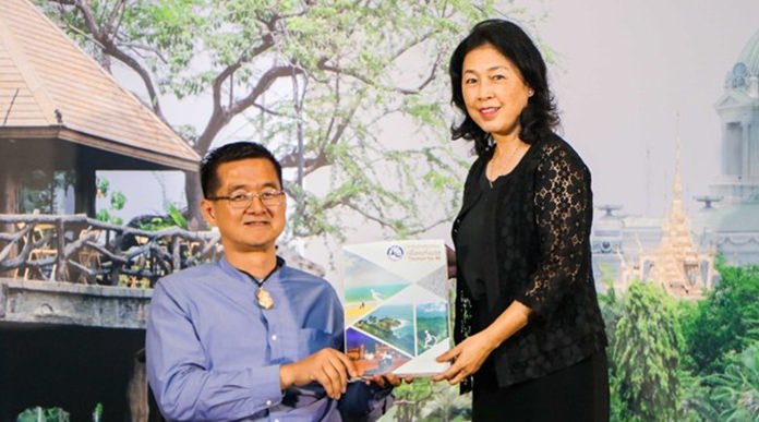 Mrs. Somrak Kumputch, TAT Deputy Governor for Administration, presents the Tourism for All guidebook to Mr, Krisana Lalai, President of Friendly Design for All Foundation, a human rights worker and a famous journalist and TV host in Thailand.