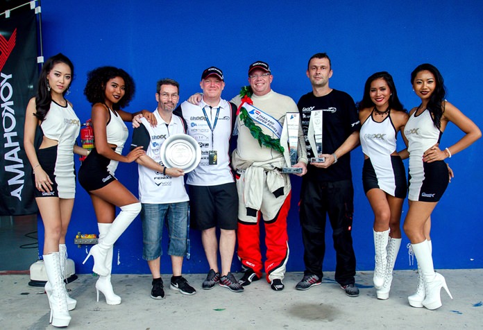 Danish driver Thomas Raldorf (5th left) celebrates with the Unixx–TR-Motorsport team after winning the GTC Supercar team championship and driver’s title at the Chang International Circuit in Buriram, Sunday, Sept. 24.